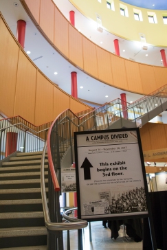 exhibit sign pointing upstairs